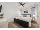 Bright bedroom featuring a large bed, neutral color scheme, and window with wooden blinds at 10738 Braesheather Ct, Highlands Ranch, CO 80126