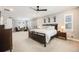 Spacious primary bedroom with a ceiling fan, neutral walls, carpet, and bright natural light at 10738 Braesheather Ct, Highlands Ranch, CO 80126