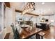 Open concept dining room leading to a modern kitchen and a comfortable living area, ideal for entertaining at 10738 Braesheather Ct, Highlands Ranch, CO 80126