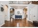 Grand foyer with wood flooring, arched doorways, and a view of the living spaces at 10738 Braesheather Ct, Highlands Ranch, CO 80126