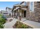 Charming front entrance with stone accents and inviting curb appeal at 10738 Braesheather Ct, Highlands Ranch, CO 80126