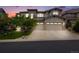 Stunning two-story home featuring a three-car garage, stone accents, and meticulously manicured landscaping at 10738 Braesheather Ct, Highlands Ranch, CO 80126