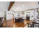 Modern kitchen with stainless steel appliances, white cabinets, large island and pendant lighting at 10738 Braesheather Ct, Highlands Ranch, CO 80126