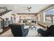 Comfortable living room features a beamed ceiling and an open floor plan connected to the kitchen at 10738 Braesheather Ct, Highlands Ranch, CO 80126