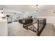 Upstairs loft with cozy seating, ample natural light, and railing overlooking downstairs at 10738 Braesheather Ct, Highlands Ranch, CO 80126