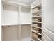 Organized walk-in closet with ample shelving, towel racks, and storage space at 2400 E Cherry Creek South Dr # 209, Denver, CO 80209