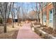 Landscaped courtyard with brick path, seating and manicured foliage at 2400 E Cherry Creek South Dr # 209, Denver, CO 80209