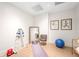 A personal exercise room with weights, yoga mat, mirror, and inspirational wall art, perfect for fitness at home at 2400 E Cherry Creek South Dr # 209, Denver, CO 80209