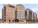 Stunning condo building with a unique circular architectural design and beautiful brick exterior at 2400 E Cherry Creek South Dr # 209, Denver, CO 80209