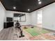 Finished basement used as a home gym with a mirror and modern decor at 13020 Julian Ct, Broomfield, CO 80020