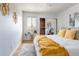 Bedroom with hardwood floors, area rug, and decorative wall art at 13020 Julian Ct, Broomfield, CO 80020