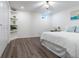 Bright bedroom with a comfortable bed, corner shelves and modern decor at 13020 Julian Ct, Broomfield, CO 80020