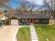 Charming single Gathering home with a well-maintained front yard, modern walkway, and a detached two-car garage at 13020 Julian Ct, Broomfield, CO 80020