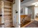 Hallway featuring a wood closet and wood railing at 13020 Julian Ct, Broomfield, CO 80020