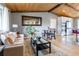 Open-concept space with hardwood floors, dining area, and a view of the modern kitchen at 13020 Julian Ct, Broomfield, CO 80020