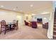 Spacious finished basement with multiple seating areas, perfect for entertaining and relaxation at 16459 W 86Th Pl # B, Arvada, CO 80007