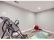 Basement area perfect for workout and yoga with an inversion table and yoga mat at 16459 W 86Th Pl # B, Arvada, CO 80007