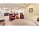 Expansive basement featuring a piano and lounge area, ideal for various activities and gatherings at 16459 W 86Th Pl # B, Arvada, CO 80007