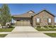 Charming single-Gathering home with a well-manicured lawn, beautiful stone facade, and attached two-car garage at 16459 W 86Th Pl # B, Arvada, CO 80007