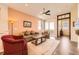 Comfortable living room featuring hardwood floors, a ceiling fan and lots of light at 16459 W 86Th Pl # B, Arvada, CO 80007