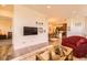 Bright living room with hardwood floors is adjacent to dining area and kitchen at 16459 W 86Th Pl # B, Arvada, CO 80007