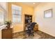 Bright office space with built-in desk, natural light, and wood-look floors offers a functional work area at 16459 W 86Th Pl # B, Arvada, CO 80007