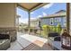 Comfortable patio area featuring comfortable chairs, a lantern, and views of the community at 16459 W 86Th Pl # B, Arvada, CO 80007