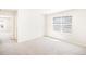 Bright bedroom with plush carpet, large window, and neutral color scheme at 22485 E 7Th Pl, Aurora, CO 80018