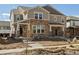 Beautiful two-story home featuring stone accents and a welcoming front porch, complete with an unfinished front yard at 22485 E 7Th Pl, Aurora, CO 80018