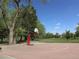 Community basketball court providing recreational space with a well-maintained red-painted surface at 8418 Everett Way # C, Arvada, CO 80005