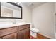 Bathroom featuring updated vanity, mirror, lighting, and fixtures at 8418 Everett Way # C, Arvada, CO 80005