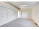 Neutral bedroom offering plush carpeting and double closets for storage at 8418 Everett Way # C, Arvada, CO 80005