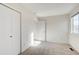Bright bedroom offering neutral tones, plush carpeting, and double closets at 8418 Everett Way # C, Arvada, CO 80005