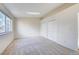 Bedroom featuring a large window and closet at 8418 Everett Way # C, Arvada, CO 80005