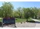 Arvada Volunteer Fire Fighters Park with trees and lush green lawn at 8418 Everett Way # C, Arvada, CO 80005