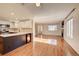 Open-concept living space features updated kitchen, wood floors, and abundant natural light at 8418 Everett Way # C, Arvada, CO 80005
