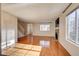 Bright living room boasts wood floors, fireplace, and abundant natural light at 8418 Everett Way # C, Arvada, CO 80005