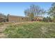 Spacious backyard features a lawn, wooden fencing, and a shed at 16755 E Union Ave, Aurora, CO 80015