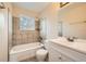 Full bathroom featuring a shower over tub and vanity with storage at 16755 E Union Ave, Aurora, CO 80015