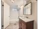 Bright bathroom with tiled shower, modern lighting, and a vanity at 16755 E Union Ave, Aurora, CO 80015