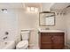 Bright bathroom featuring a tiled shower, vanity, and modern lighting at 16755 E Union Ave, Aurora, CO 80015