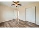 Comfortable bedroom featuring hardwood floors and ample closet space at 16755 E Union Ave, Aurora, CO 80015