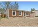 Cozy brick home with a low-maintenance front yard and convenient attached garage at 16755 E Union Ave, Aurora, CO 80015
