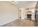Eat-in kitchen with stainless steel range and updated cabinets at 16755 E Union Ave, Aurora, CO 80015