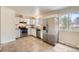Updated kitchen features modern appliances and an open layout to the dining area at 16755 E Union Ave, Aurora, CO 80015