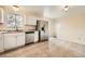 Updated kitchen features modern appliances and an open layout to the dining area at 16755 E Union Ave, Aurora, CO 80015