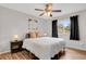 Cozy bedroom featuring hardwood floors, ceiling fan, and a window with outside views at 2103 Coronado N. Pkwy # D, Denver, CO 80229