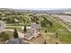 Scenic aerial view of a home nestled within a community with lush greenery and mountain views at 937 Caribou Dr, Monument, CO 80132