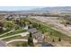 Expansive aerial view of a residential area with homes surrounded by nature and mountain vistas at 937 Caribou Dr, Monument, CO 80132
