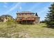 Spacious backyard with a large deck, ideal for outdoor living and entertaining at 937 Caribou Dr, Monument, CO 80132